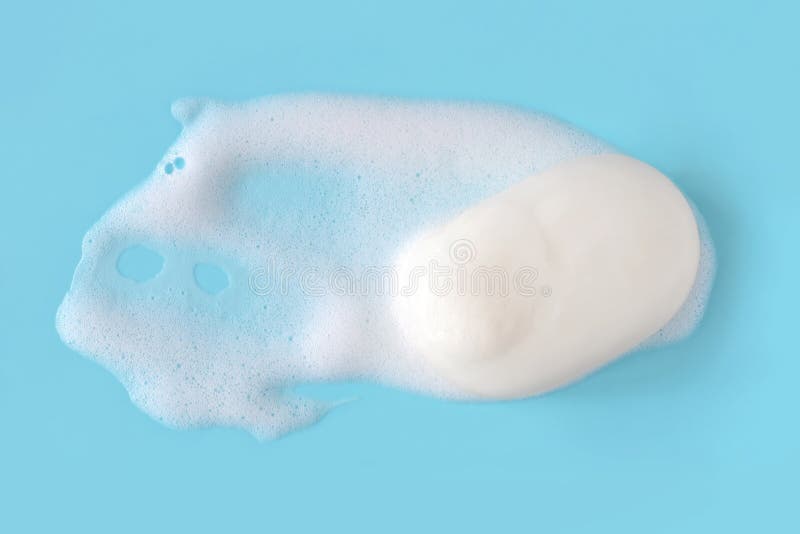 Tvålskum bubblar på blått bakgrundsmakroslut upp royaltyfri foto Tvålskum bubblar på blått bakgrundsmakroslut upp royaltyfri foto