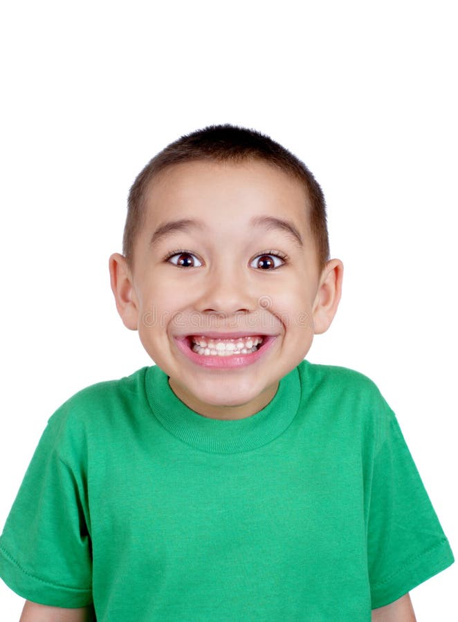 Six-year-old boy making a silly face, with a big toothy smile, isolated on white background. Six-year-old boy making a silly face, with a big toothy smile, isolated on white background