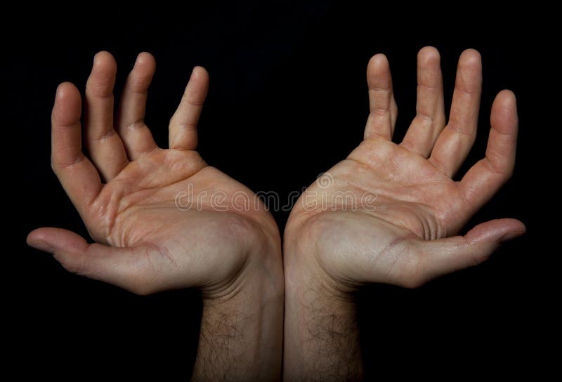 Two hands are joined to accommodate something. Maybe they are ready to embrace the faith? Maybe ask for alms? Maybe welcome a needy? Black background. Two hands are joined to accommodate something. Maybe they are ready to embrace the faith? Maybe ask for alms? Maybe welcome a needy? Black background