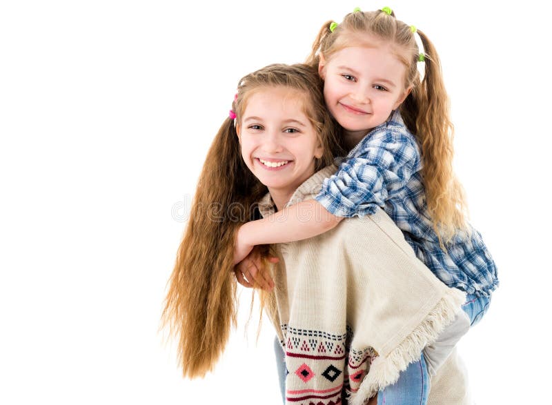 Twee vrij kleine zusters die pret hebben samen royalty-vrije stock foto Twee vrij kleine zusters die pret hebben samen royalty-vrije stock foto