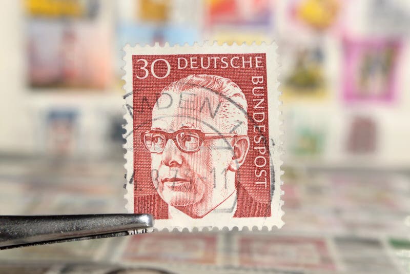 Tweezer holds postage stamp of Germany Federal President Dr. Gustav Heinemann stock photos Tweezer holds postage stamp of Germany Federal President Dr. Gustav Heinemann stock photos