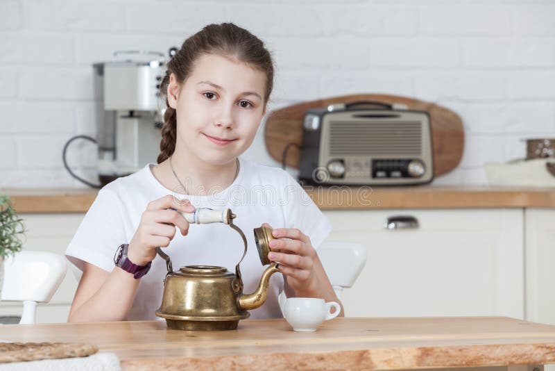 https://thumbs.dreamstime.com/b/twelve-years-old-caucasian-girl-holding-teapot-opened-cap-hands-looking-camera-kitchen-interior-twelve-years-old-girl-148177060.jpg