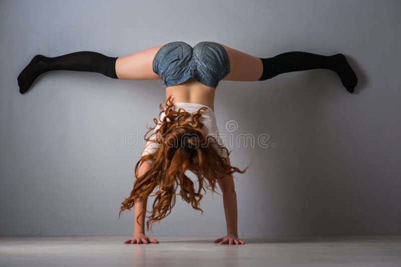 Twerk redhead woman in jeans shorts