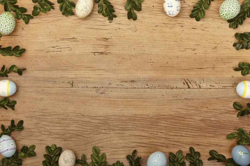 Twigs and easter eggs as frame on wood, copy space stock image Twigs and easter eggs as frame on wood, copy space stock image