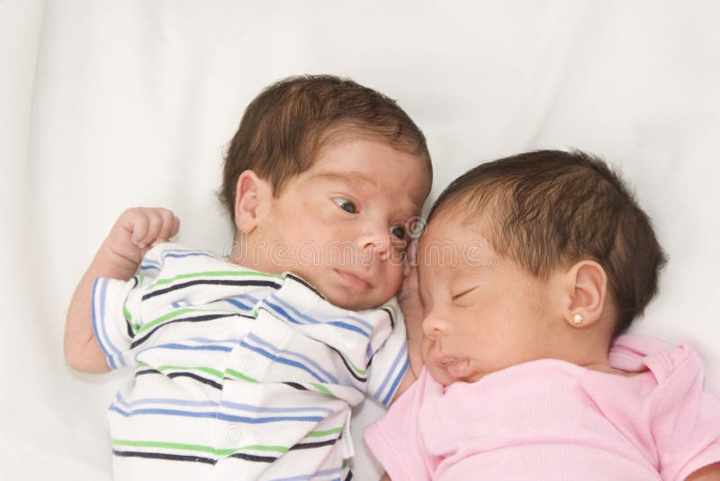 Portrait of twin babies boy and girl. Lovely european female stock images, royalty-free photos and pictures