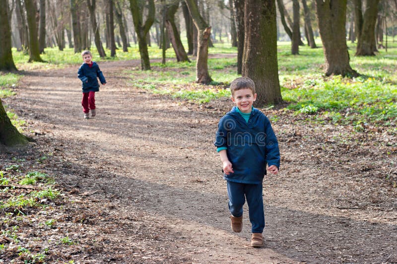 Twin brothers on a forest road