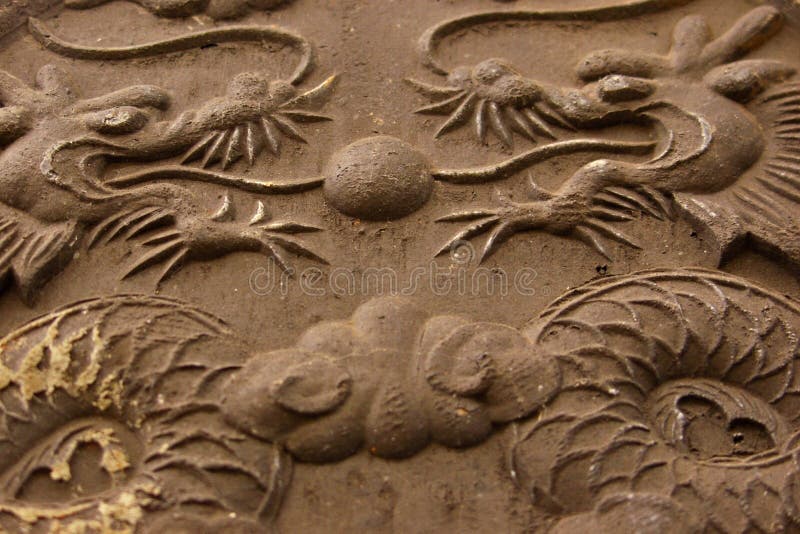 Twin dragons in stone relief