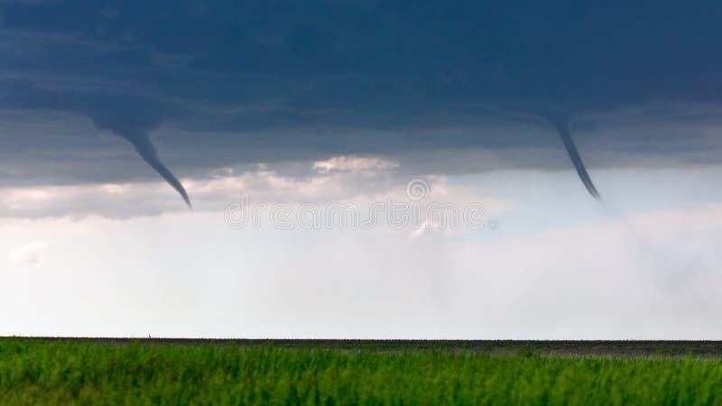 Twin funnel clouds from a pair of landspout tornadoes