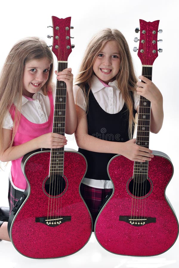 Twin sisters with guitars