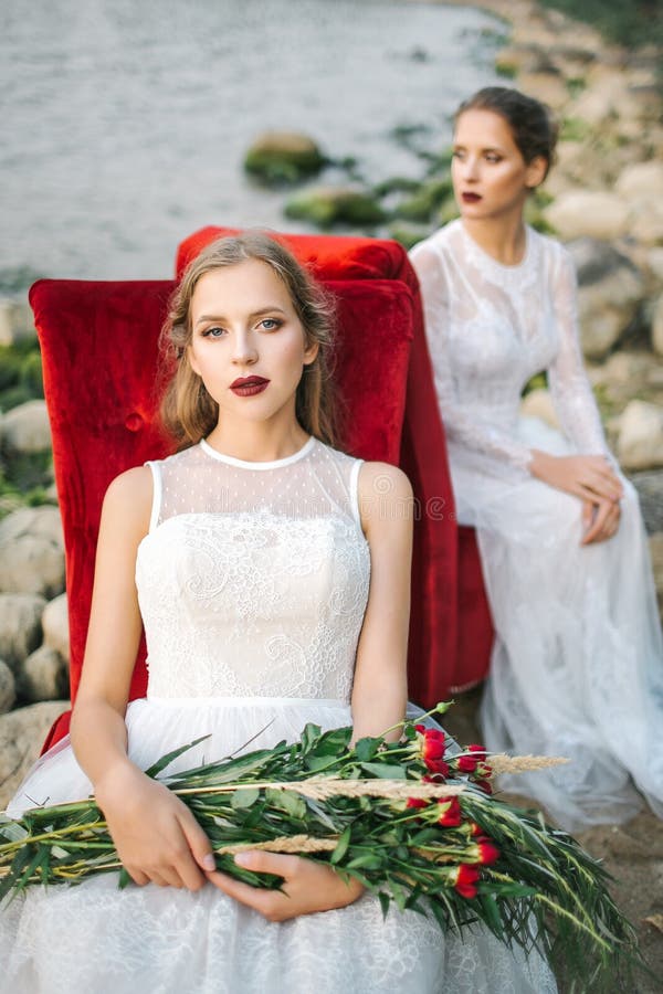 Twin Sisters in Wedding Dress on the Seashore Stock Image - Image of ...