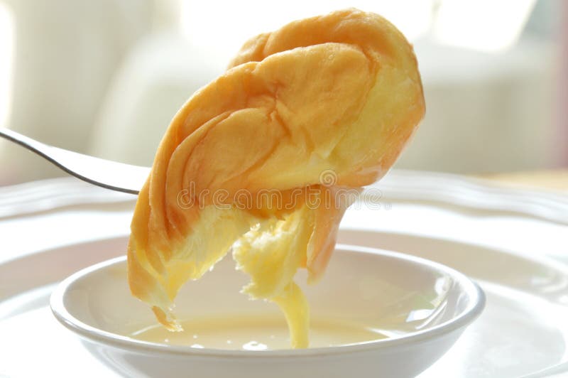 Twist Bread Dipping Sweetened Condensed Milk Stab in Fork Stock Image
