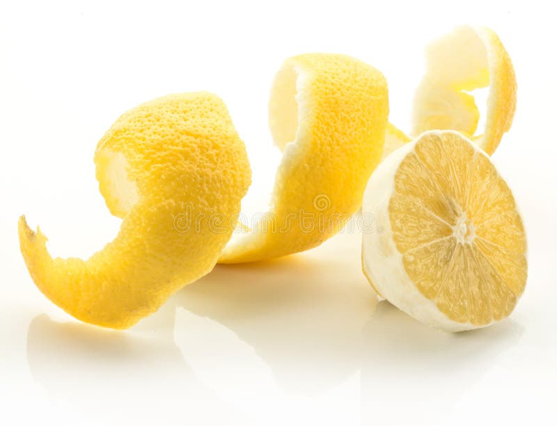 Twist of citrus peel on a white background. Twist of citrus peel on a white background.