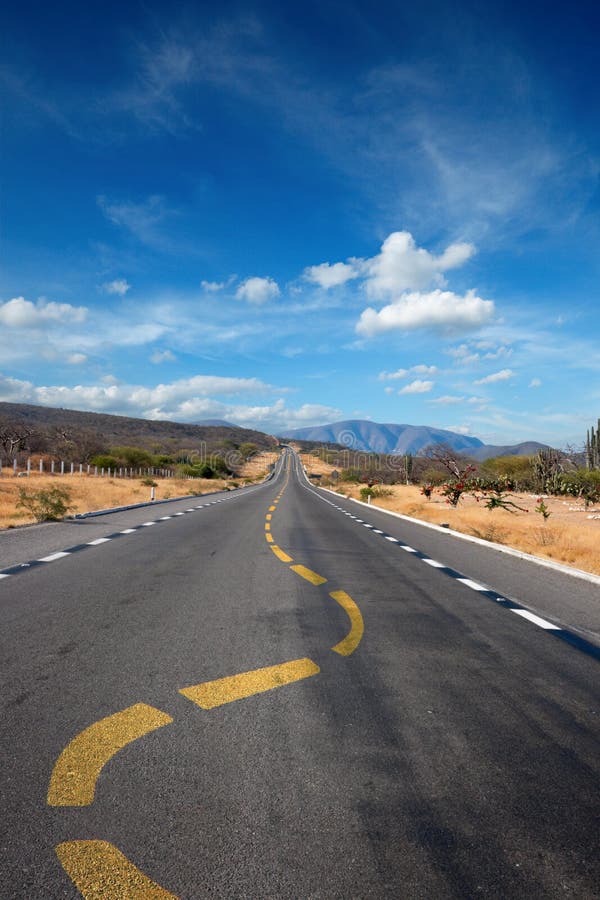 Twisting lane marking on road in desert