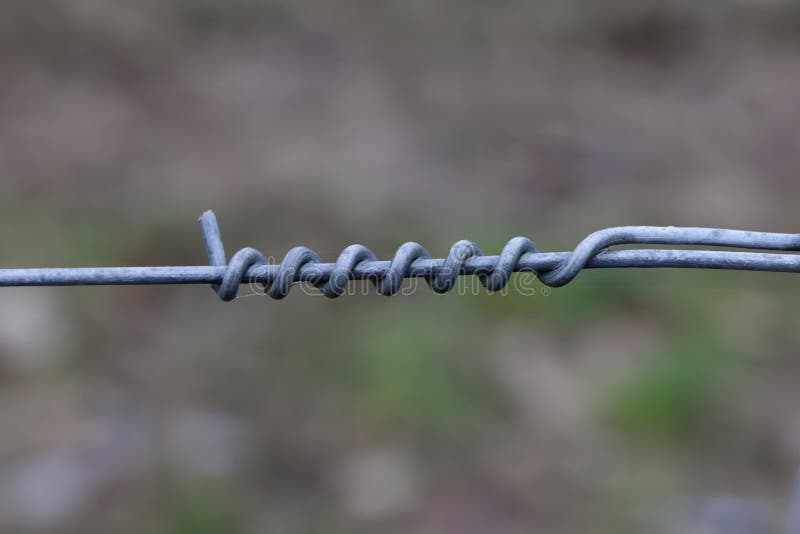 Twisting of Metal Wire on an Electric Fence Stock Photo Image of