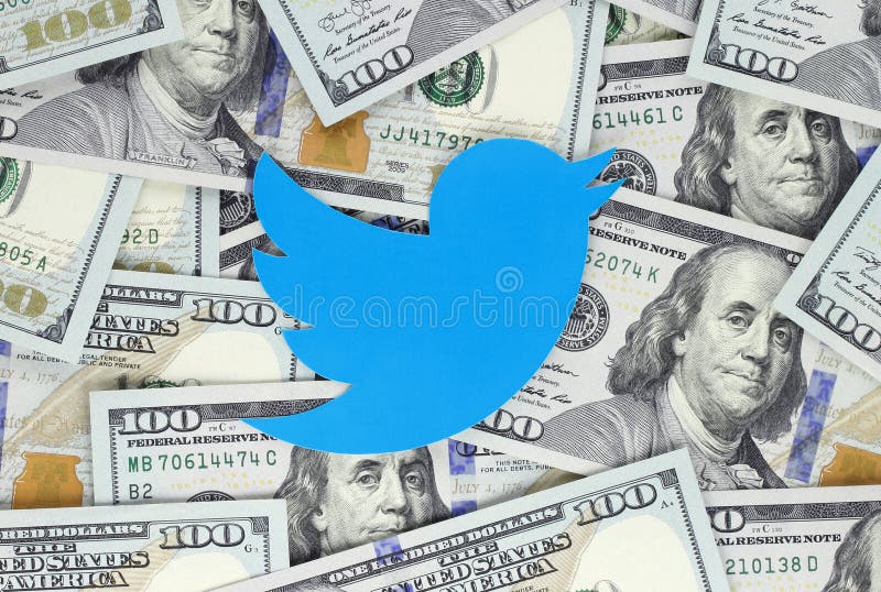 Twitter bird icon printed on paper, cut and placed on money background