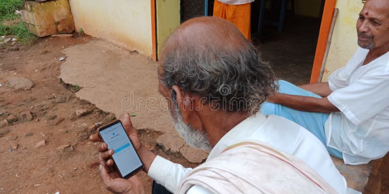 Twitter page displayed on mobile phone screen by indian village people