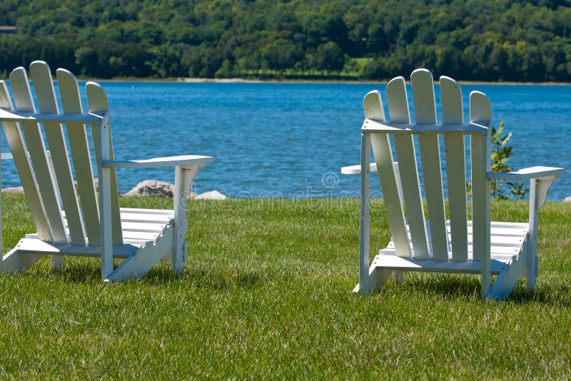Two Adirondack Chairs by the Lake