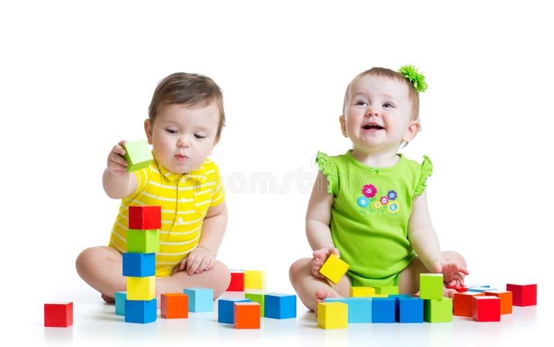 Two adorable kids playing with toys. Toddlers girl