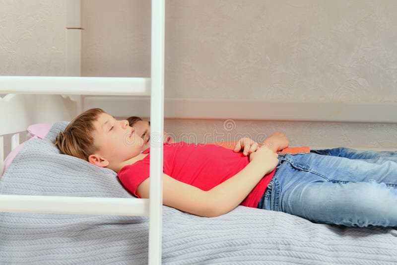 Two Adult Boys Sleep Dressed on the Bed Stock Image Image of friend
