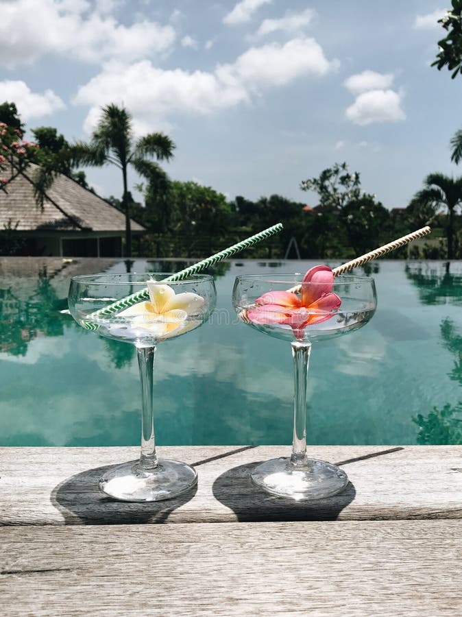 Two alcoholic cocktails at tropical villa near swimming pool stock photos Two alcoholic cocktails at tropical villa near swimming pool stock photos