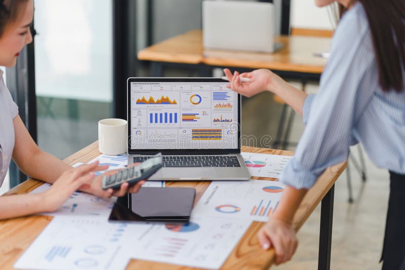 Two analyst women using KPI dashboard for data analytics. Digital data technology concept. stock images