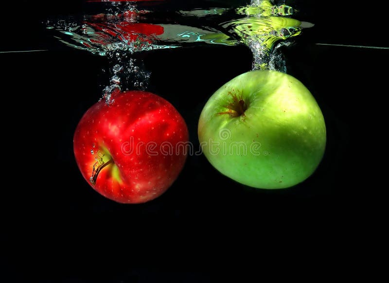 Two apples falling into water