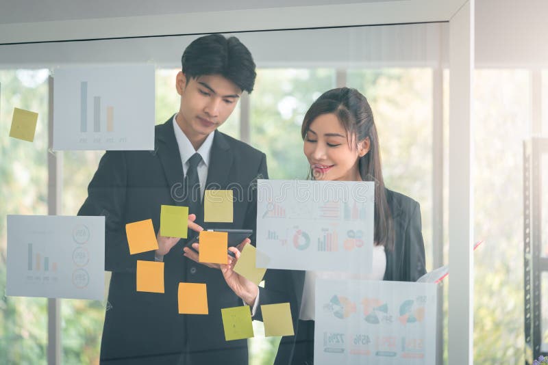 Two Business people, Male and Female is brainstorming and coaching in office meeting royalty free stock photo