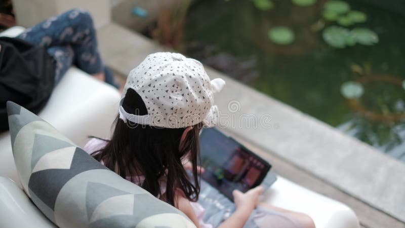 Asian man fun playing video games console with his girlfriend