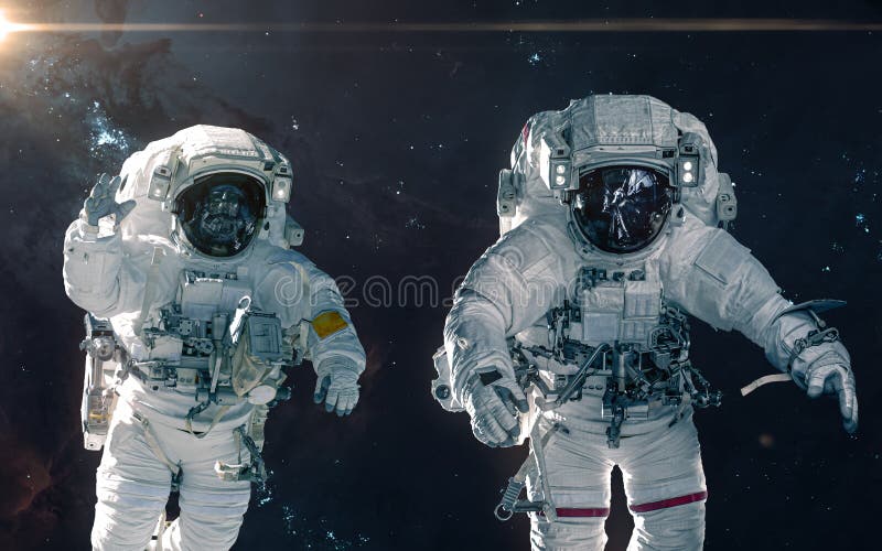 Two astronauts on background of nebulae and star clusters. Deep space landscape. Science fiction royalty free stock photos