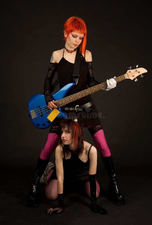 Two attractive girls with guitar