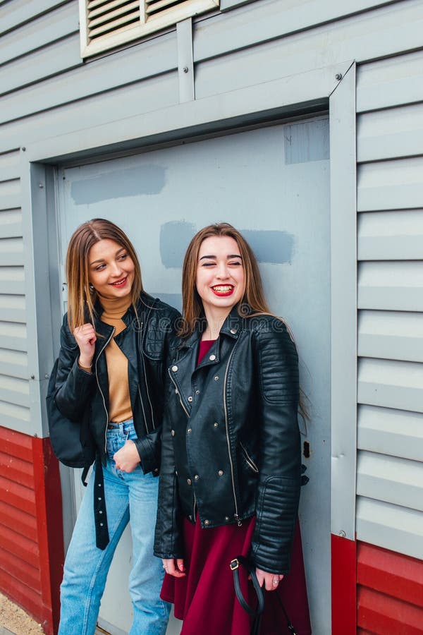 Two Attractive Young Girl Friends Standing Together and Posing on ...