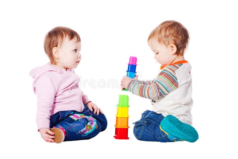 Two babies playing with toy