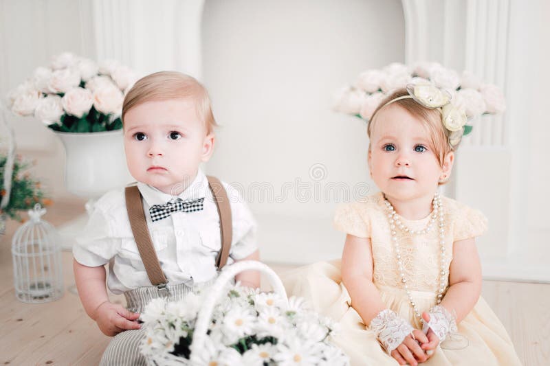 Two Babies Wedding Boy and Girl Dressed As Bride and Groom Stock