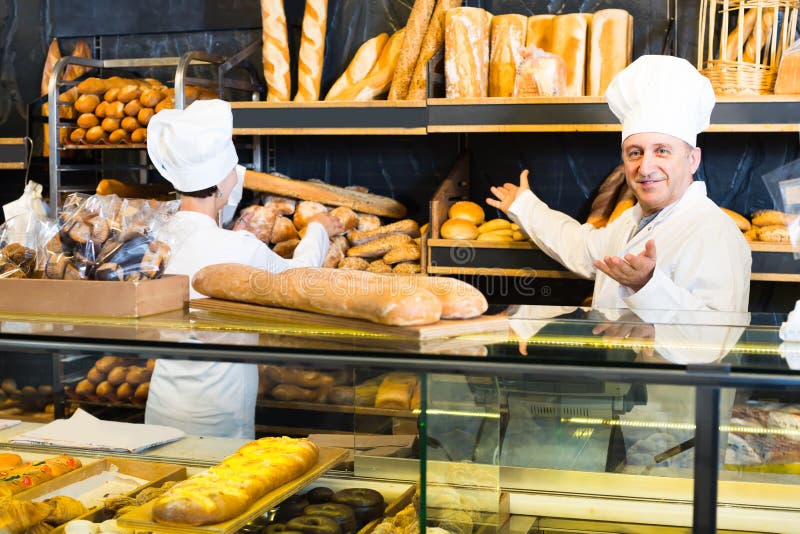 Two Bakers at the Counter at Bakery Stock Image Image of couple loaf Two Bakers at the Counter at Bakery Stock Image Image of couple loaf