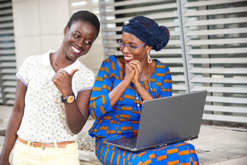 Two Beautiful Adult Business Women Working On Laptop Outside Stock Image Image Of Abidjan
