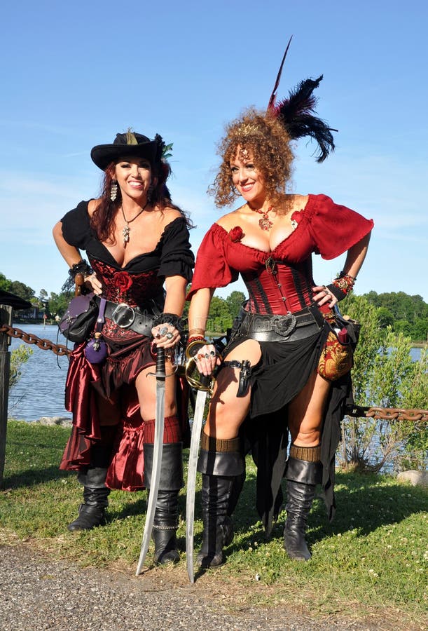 two-beautiful-female-pirates-lovely-women-dressed-as-stand-holding-their-swords-image-taken-annual-blackbeard-pirate-s-54652535.jpg