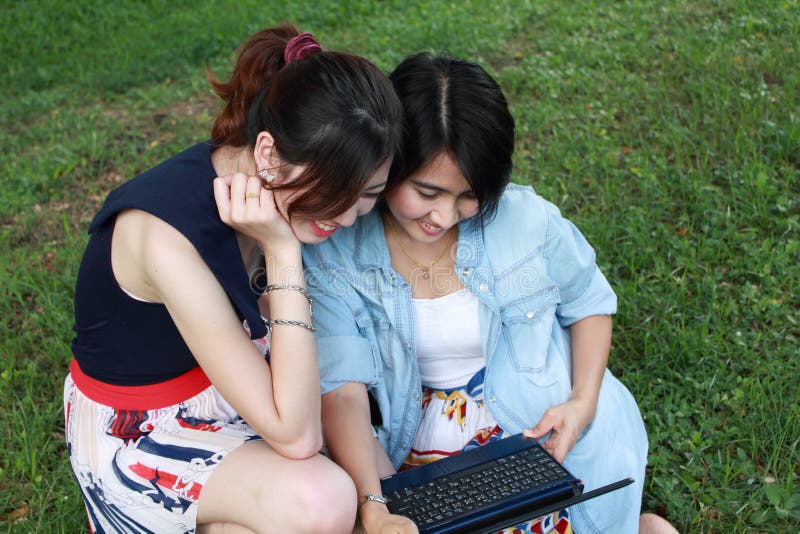 Two beautiful girls with laptop