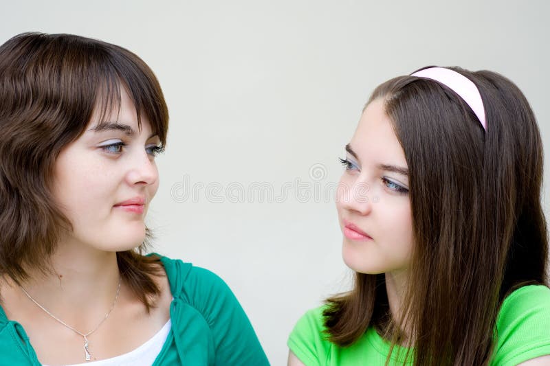 Two Beautiful Girls Look At Each Other Stock Image Image Of Closeup