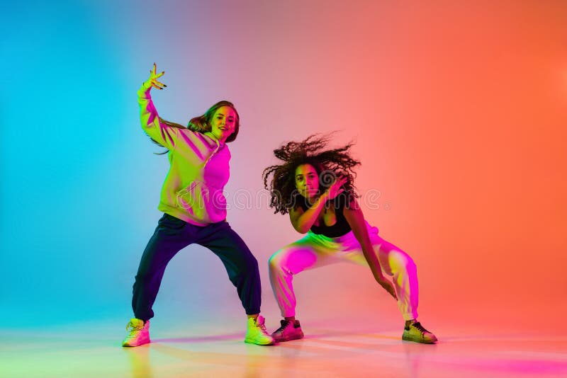 Two Beautiful Stylish Hip-hop Dancers on Colorful Gradient Background in  Neon Lights Stock Photo - Image of blue, fashion: 228709060