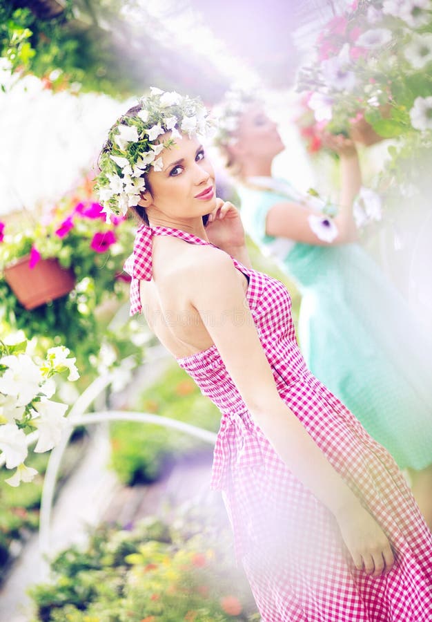 Two beautiful women in the huge garden