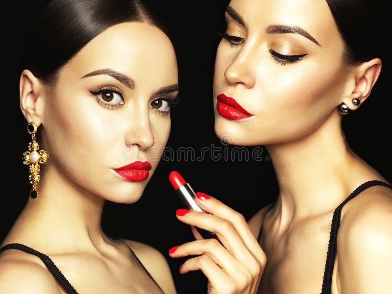 Two beautiful young ladies with red lipstick royalty free stock photos Two beautiful young ladies with red lipstick royalty free stock photos