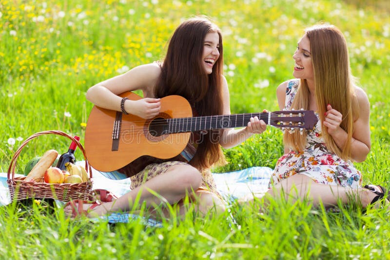 Two beautiful young women on a picnic