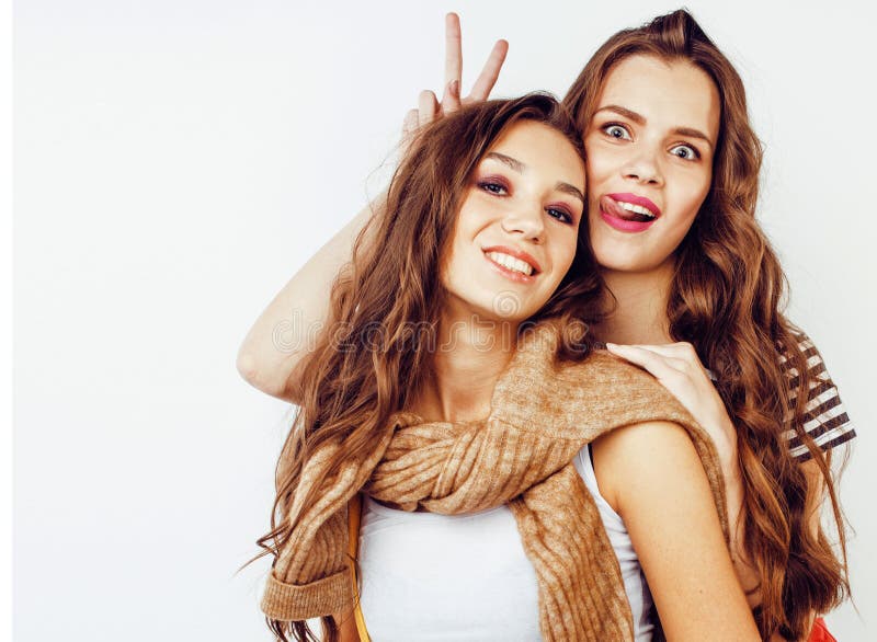 Fashion Portrait Of Two Girls, Best Friends Posing Indoor On Beige  Background Wearing Winter Stylish Coat. Stock Photo, Picture and Royalty  Free Image. Image 121423209.