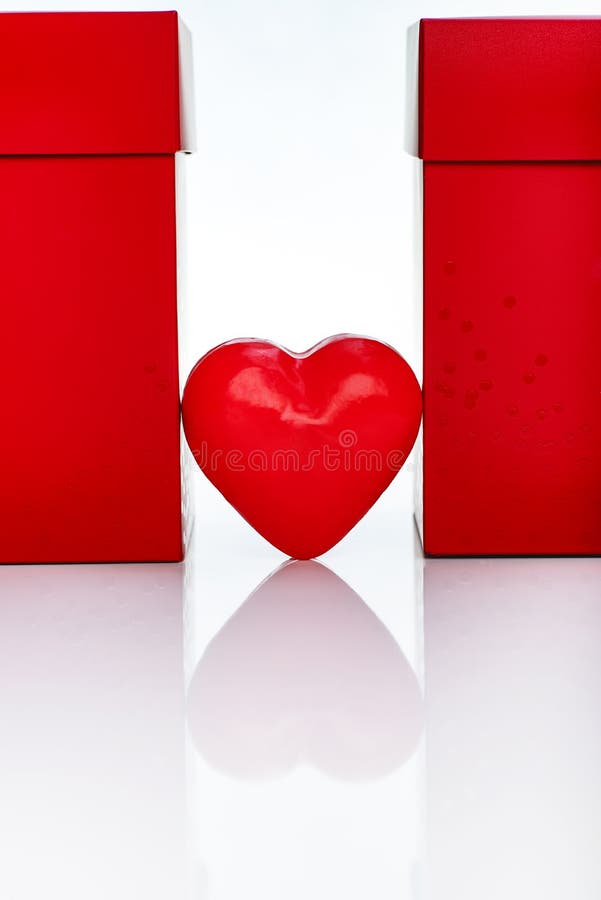 Two Big Red Gift Boxes And Red Wax Heart. stock images Two Big Red Gift Boxes And Red Wax Heart. stock images
