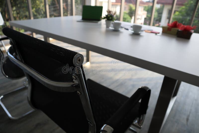 Two black chairs and white table and other stuffs stock image Two black chairs and white table and other stuffs stock image