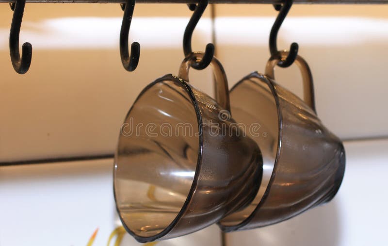 Two Black Coffee Cups Hanging on Hooks Stock Photo Image of retro