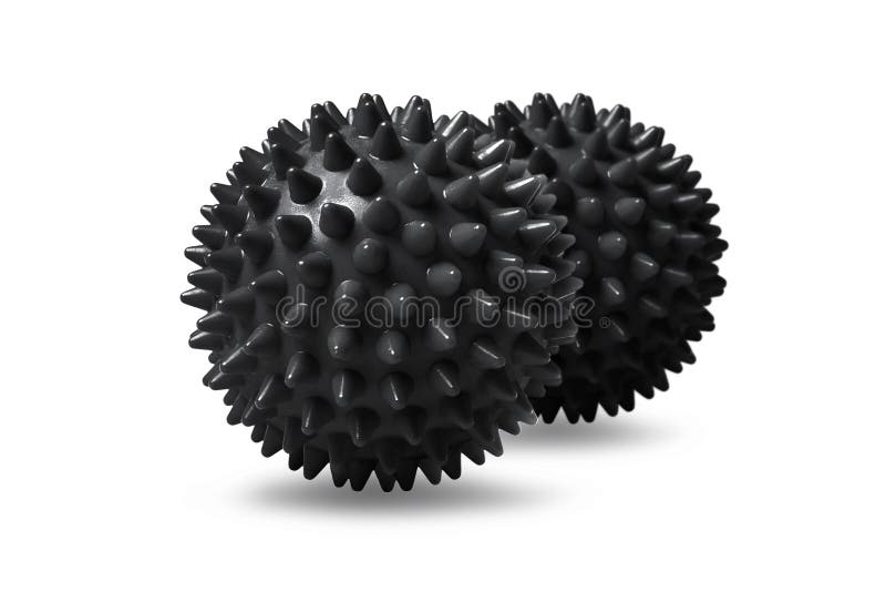 Two black spiny massage balls isolated on white. Concept of physiotherapy or fitness. Closeup of a colorful rubber ball for dog teeth on a white color background. Corona virus model.