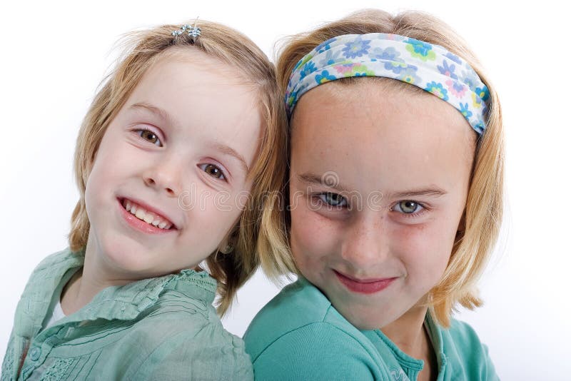 Two blond sisters stock photos