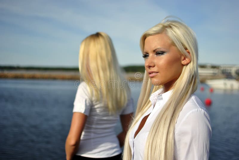 Two blonde girls on the beach