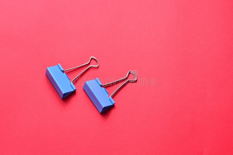 Two Blue Binder Clips on Red Background Stock Image Image of blue